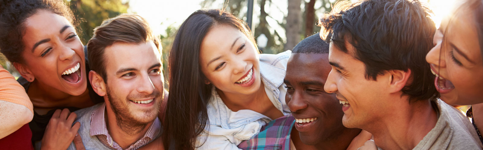 Group of young adult friends smiling and laughing together